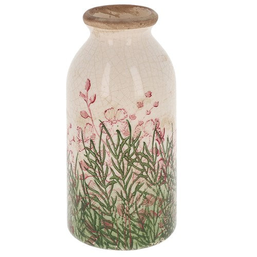 Decorative bottle vase with floral design and wooden cap on a white background
