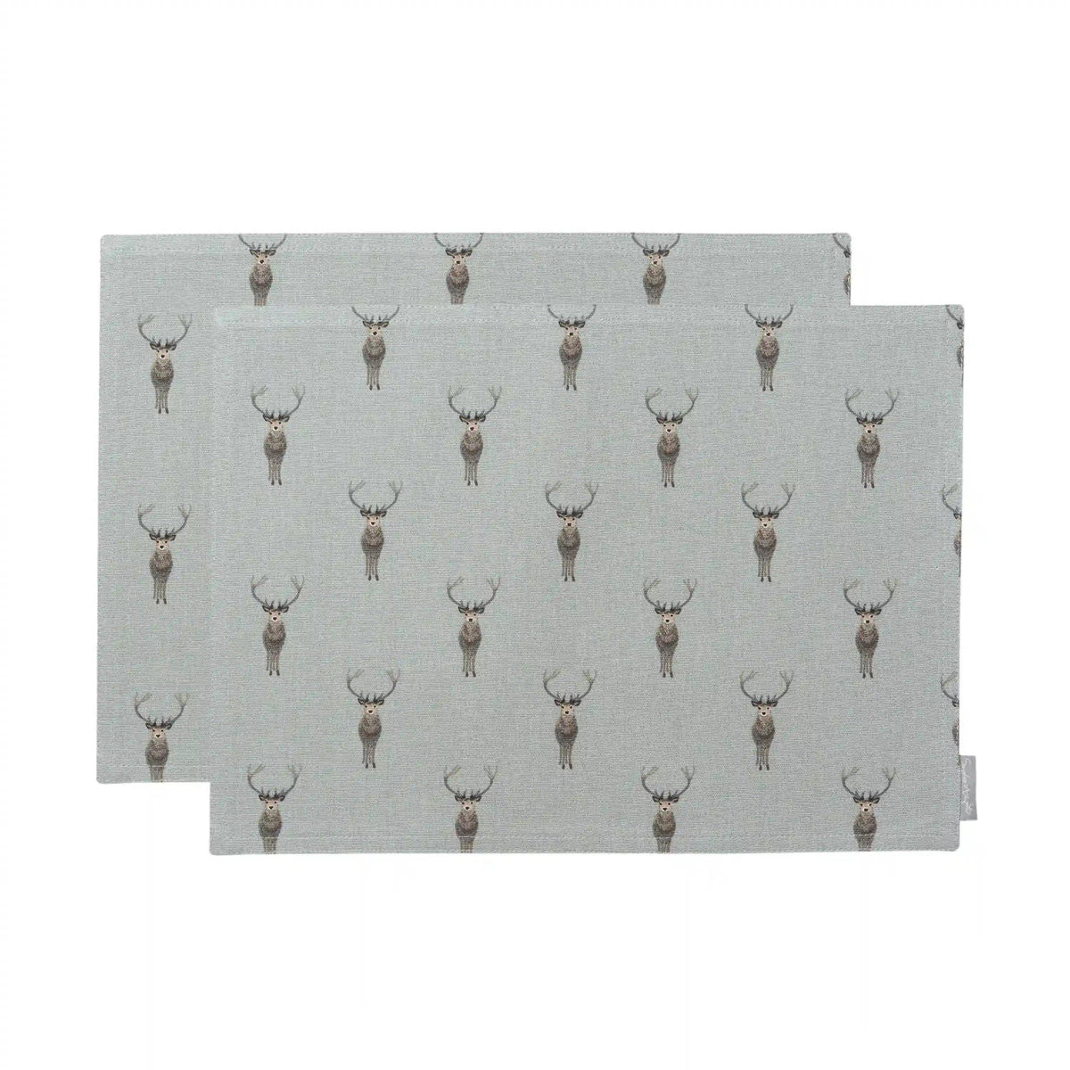 Two rectangular placemats with a repeating deer print on a light gray background, shown overlapping on a white studio background.