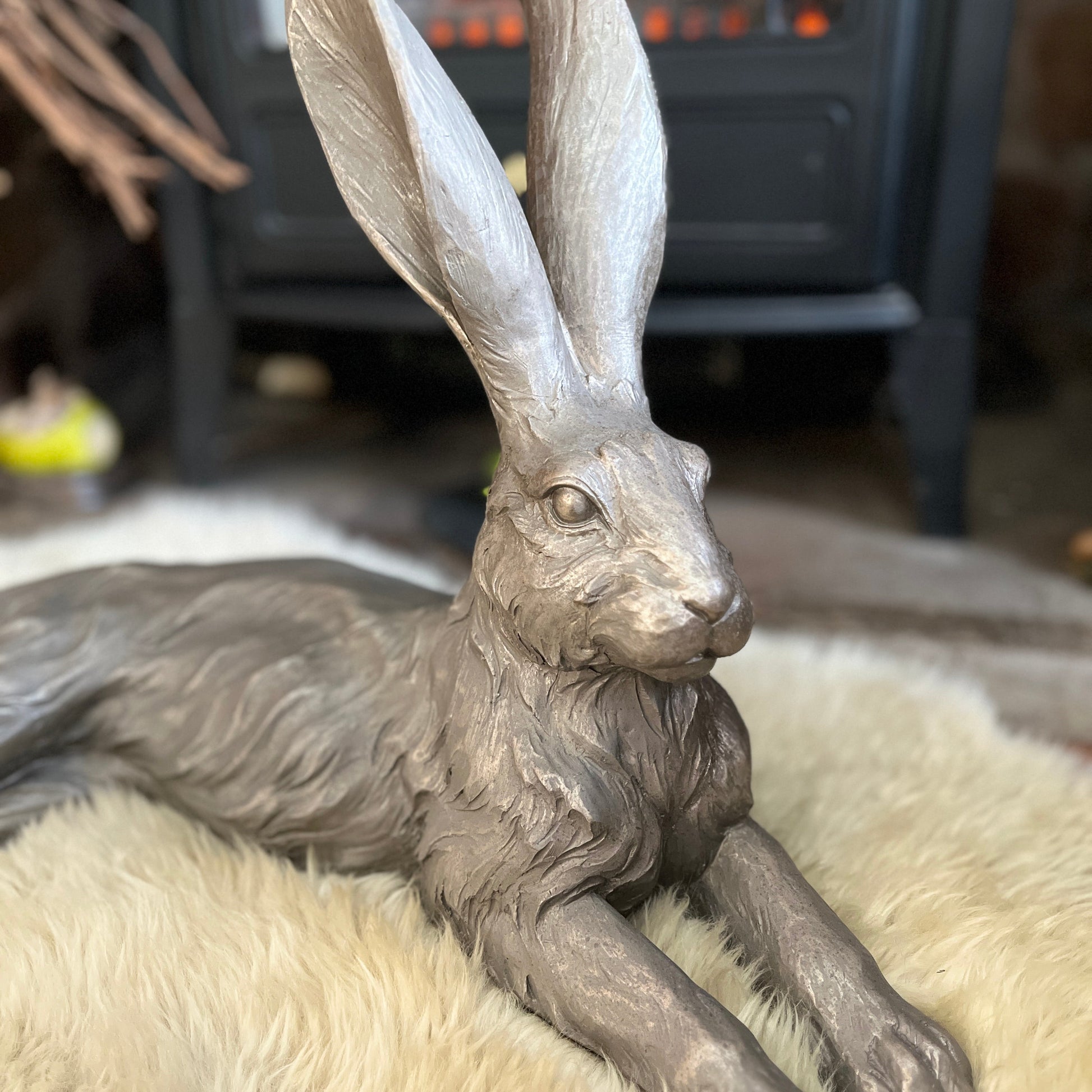 Close up of large hare ornament face on a fluffy surface