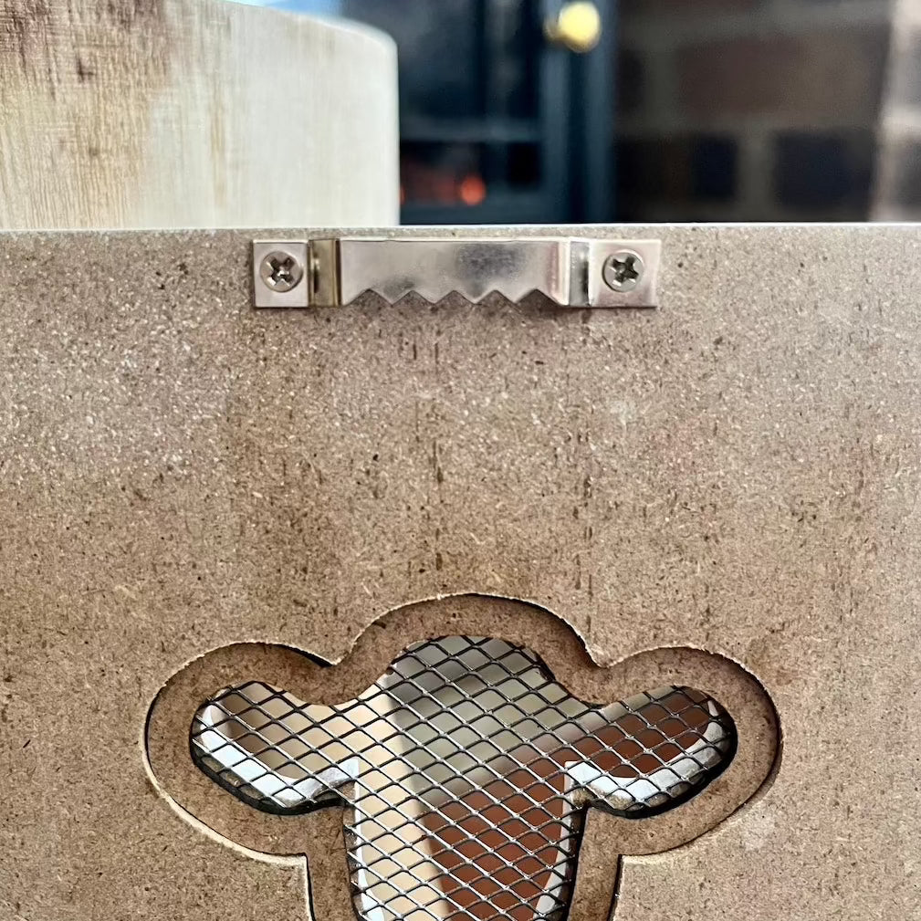 Showing the Clip of the Back of the Wooden Cow Quote Sign