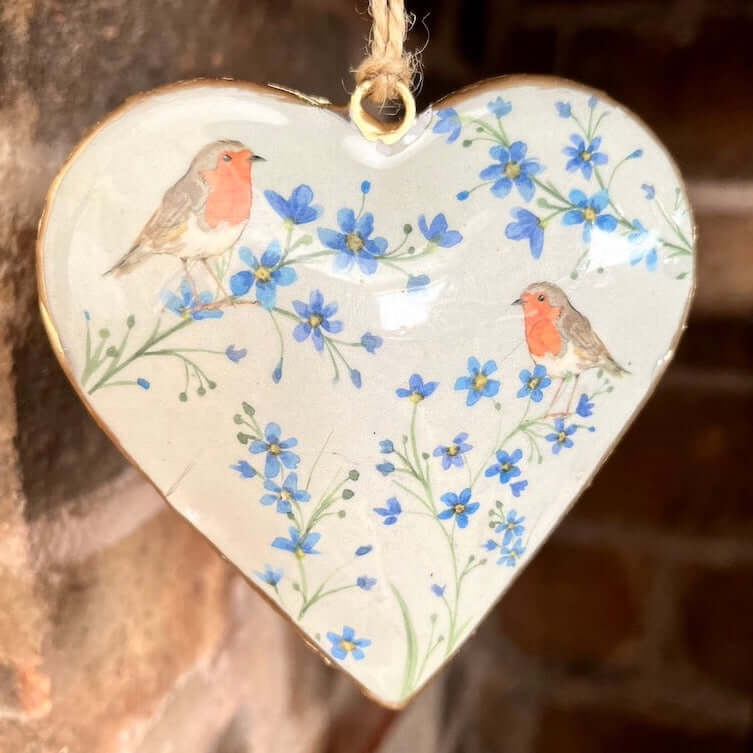 Close Up of Metal Robin Hanging Heart