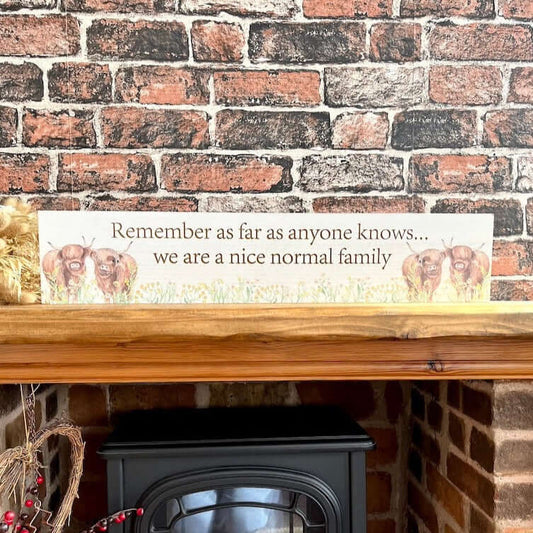 Family Highland Cow Sign Displayed on Hearth 