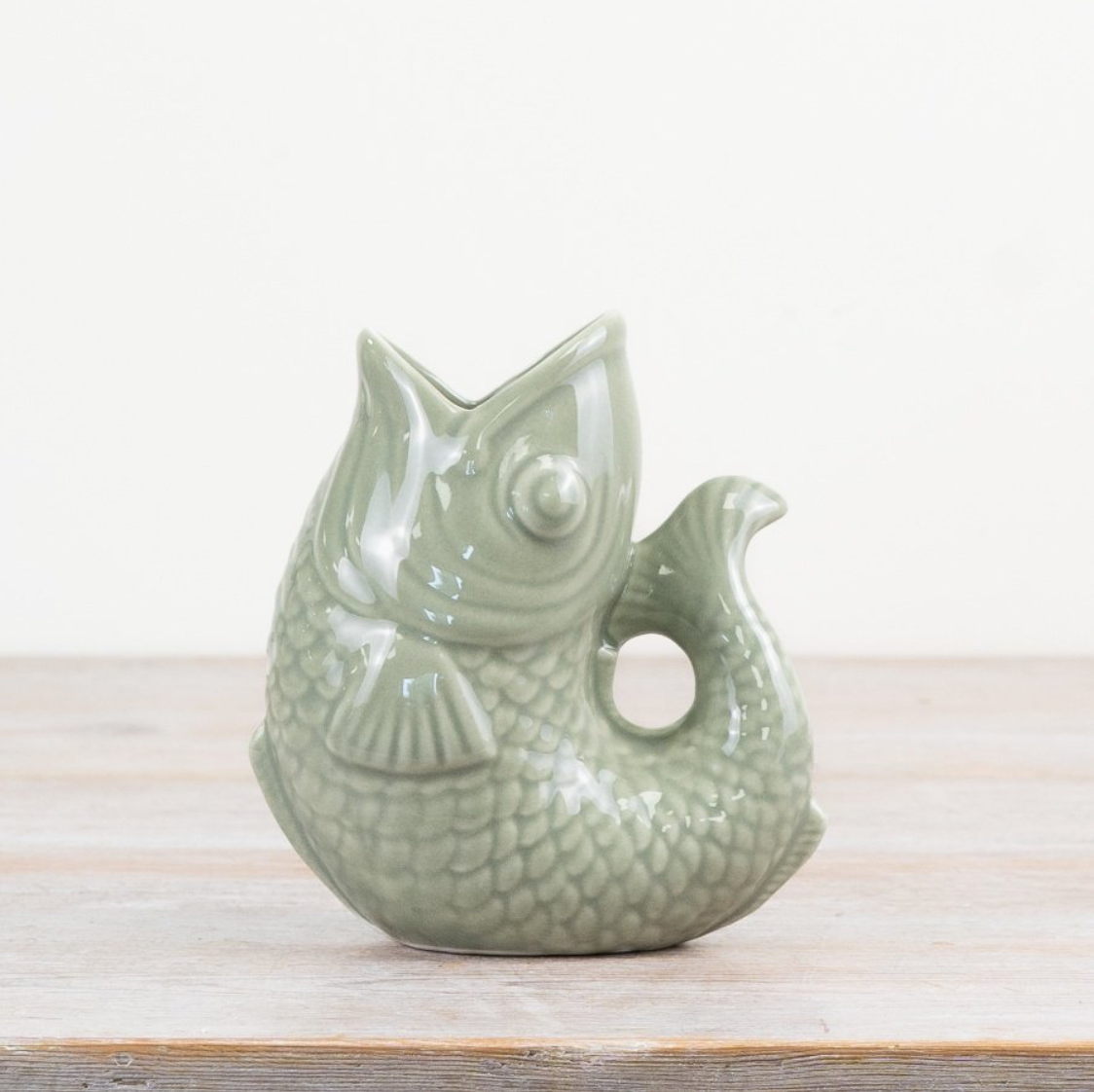 Gluggle jug in sage green - ceramic fish vase with a detailed fish design, ideal for serving drinks or as a decorative piece.