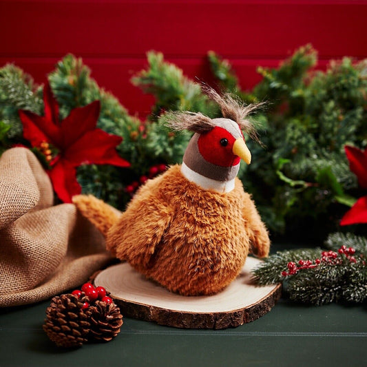 Pheasant Door Stop Surrounded By Christmas Accessories
