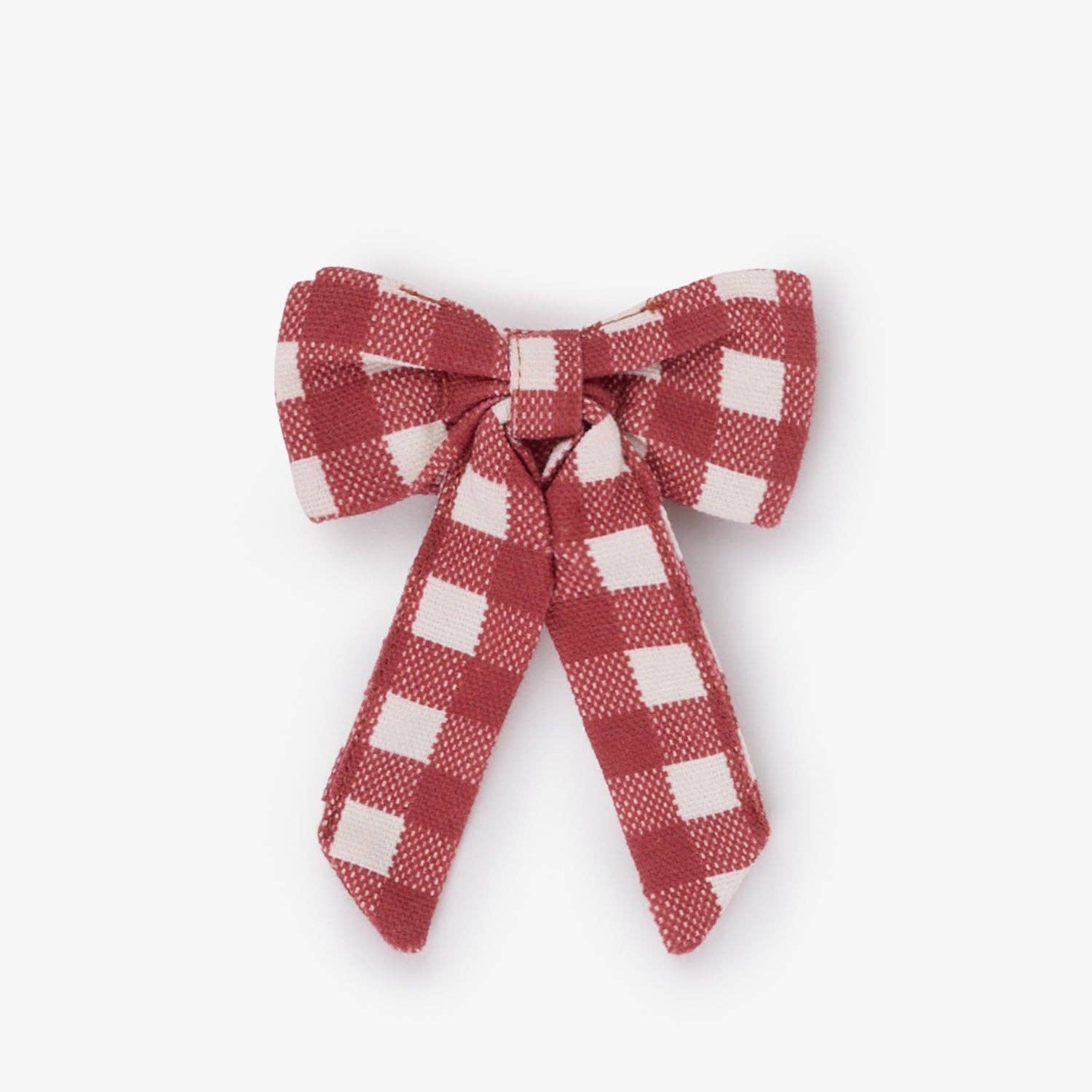 A small fabric bow in a red and white gingham check pattern, photographed against a plain light gray background.