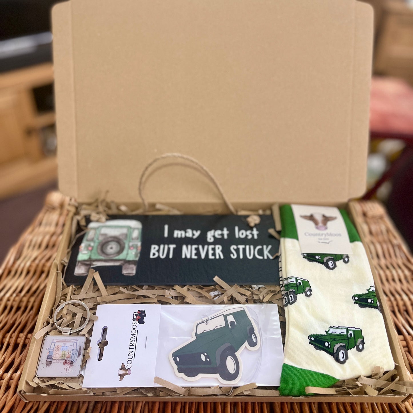 Gift set with socks and a plaque on a woven surface