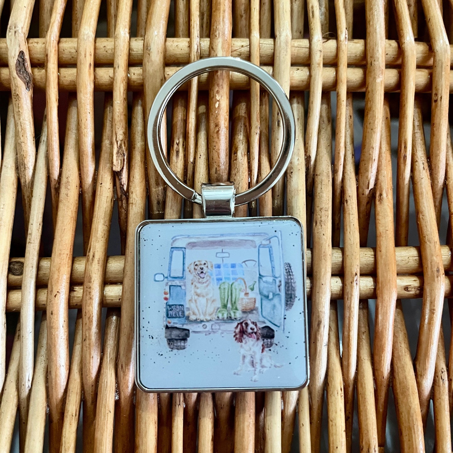 Keyring with a design on a woven surface