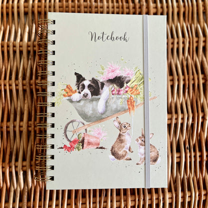 Notebook with animal illustrations on a wicker surface