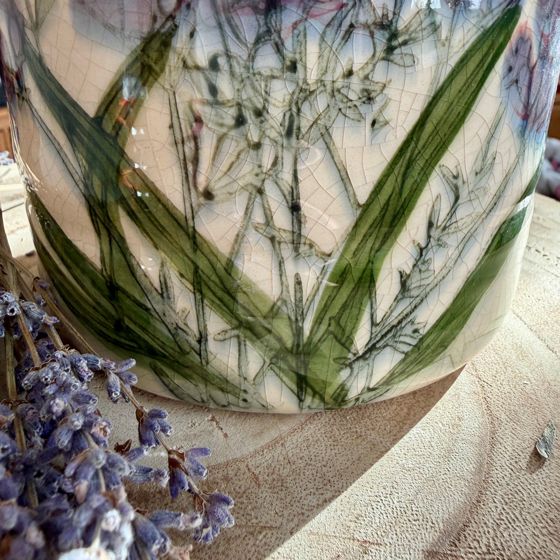 Decorative vase with floral design on a textured surface