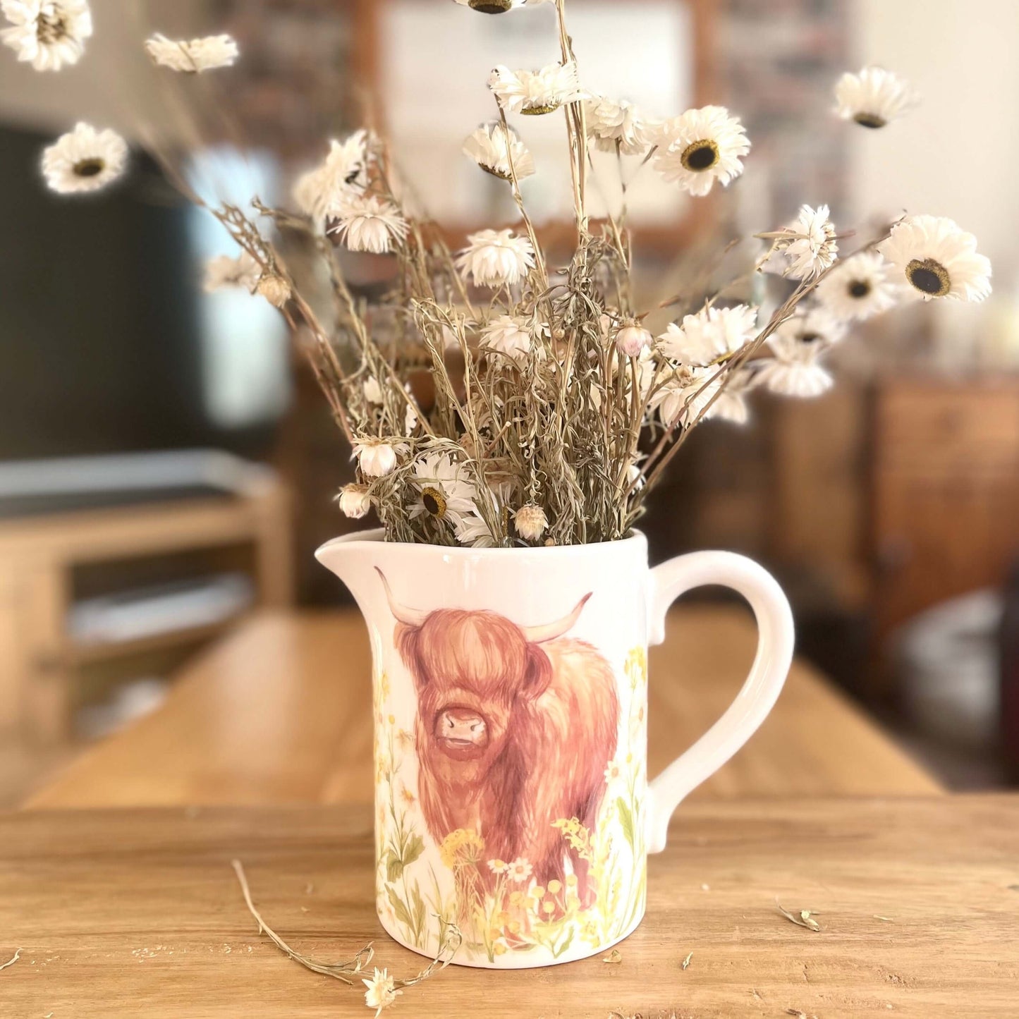 Spring Highland Cow Jug With Dried Flowers Blurred background