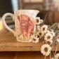 Spring Highland Cow Jug From Left Side