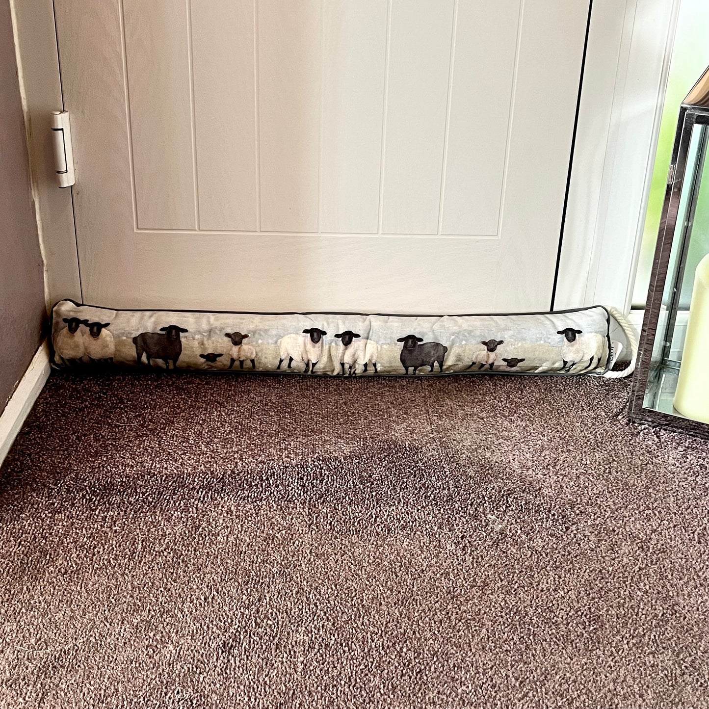Sheep Draught Excluder Displayed In Front of Door